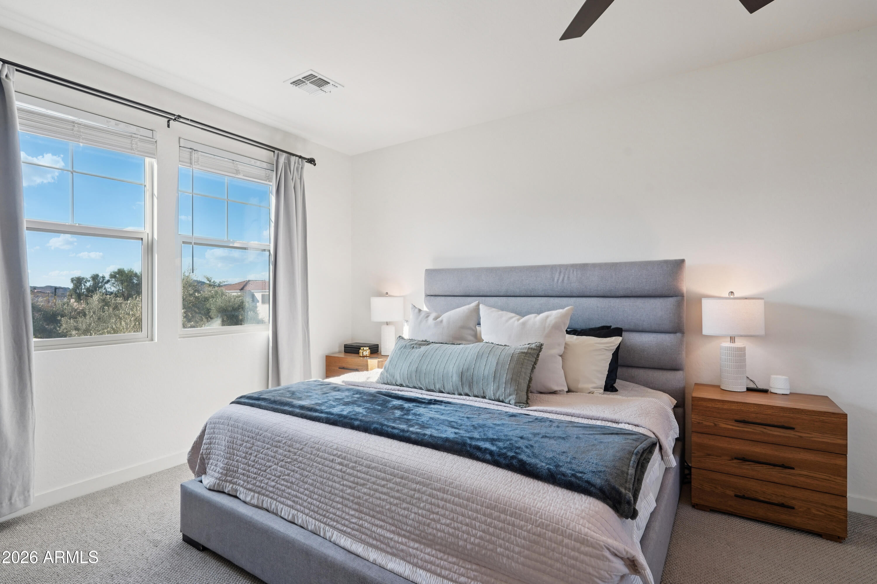 17153 North 10th Street Phoenix, AZ 85022 - Photo 28 of 48 a bedroom with a bed and a window