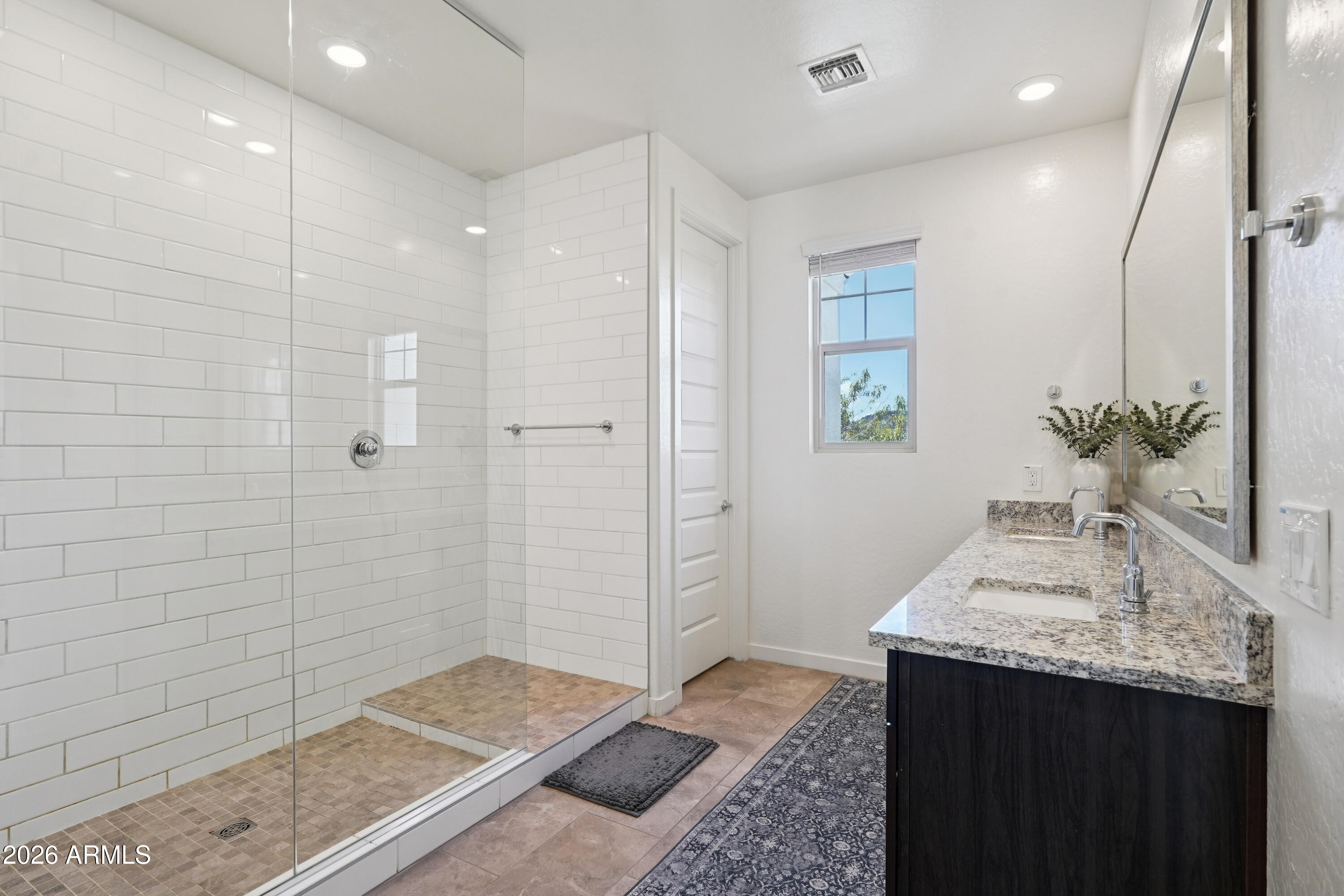 17153 North 10th Street Phoenix, AZ 85022 - Photo 29 of 48 a bathroom with a sink and a mirror