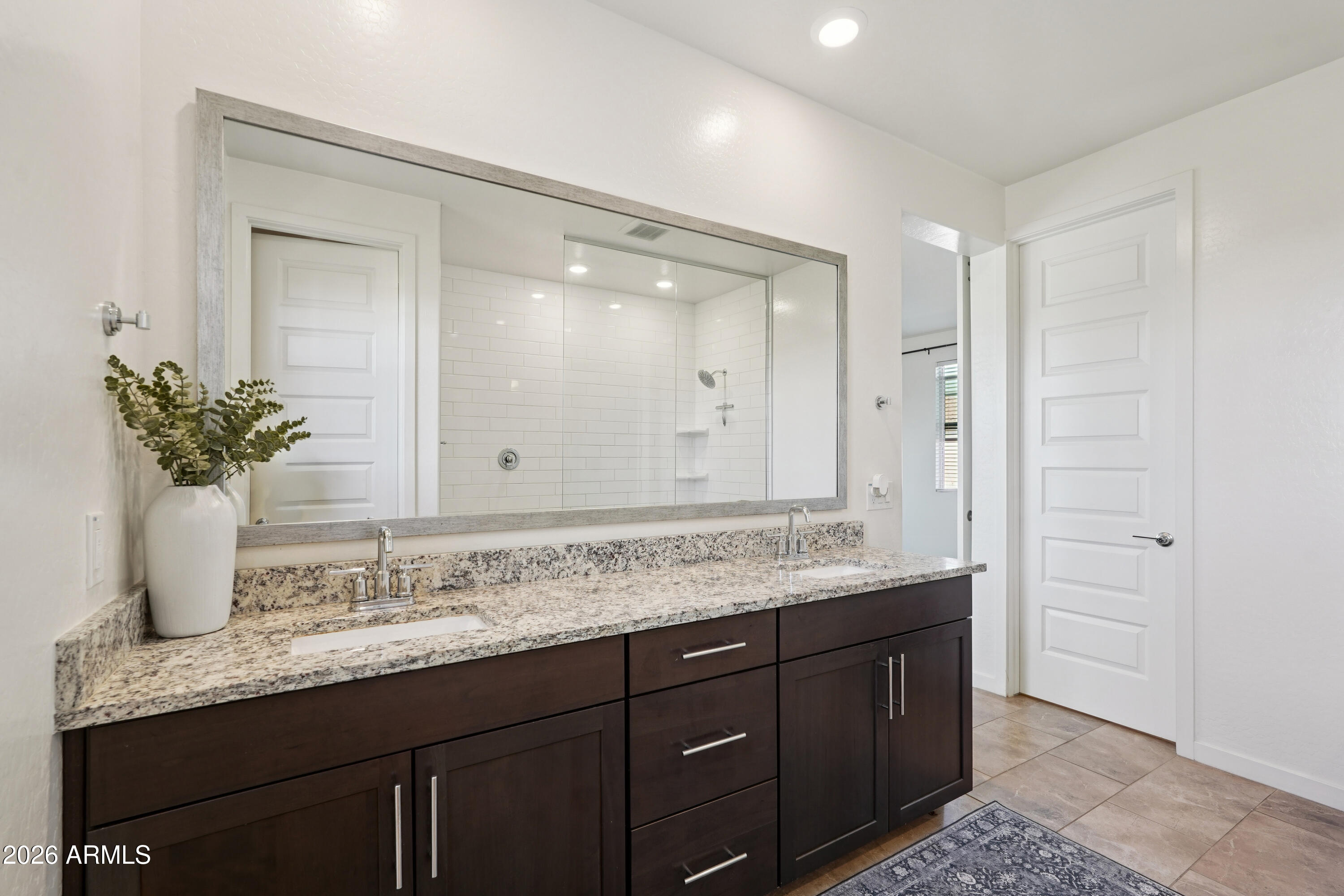 17153 North 10th Street Phoenix, AZ 85022 - Photo 30 of 48 a bathroom with a granite countertop sink and a mirror