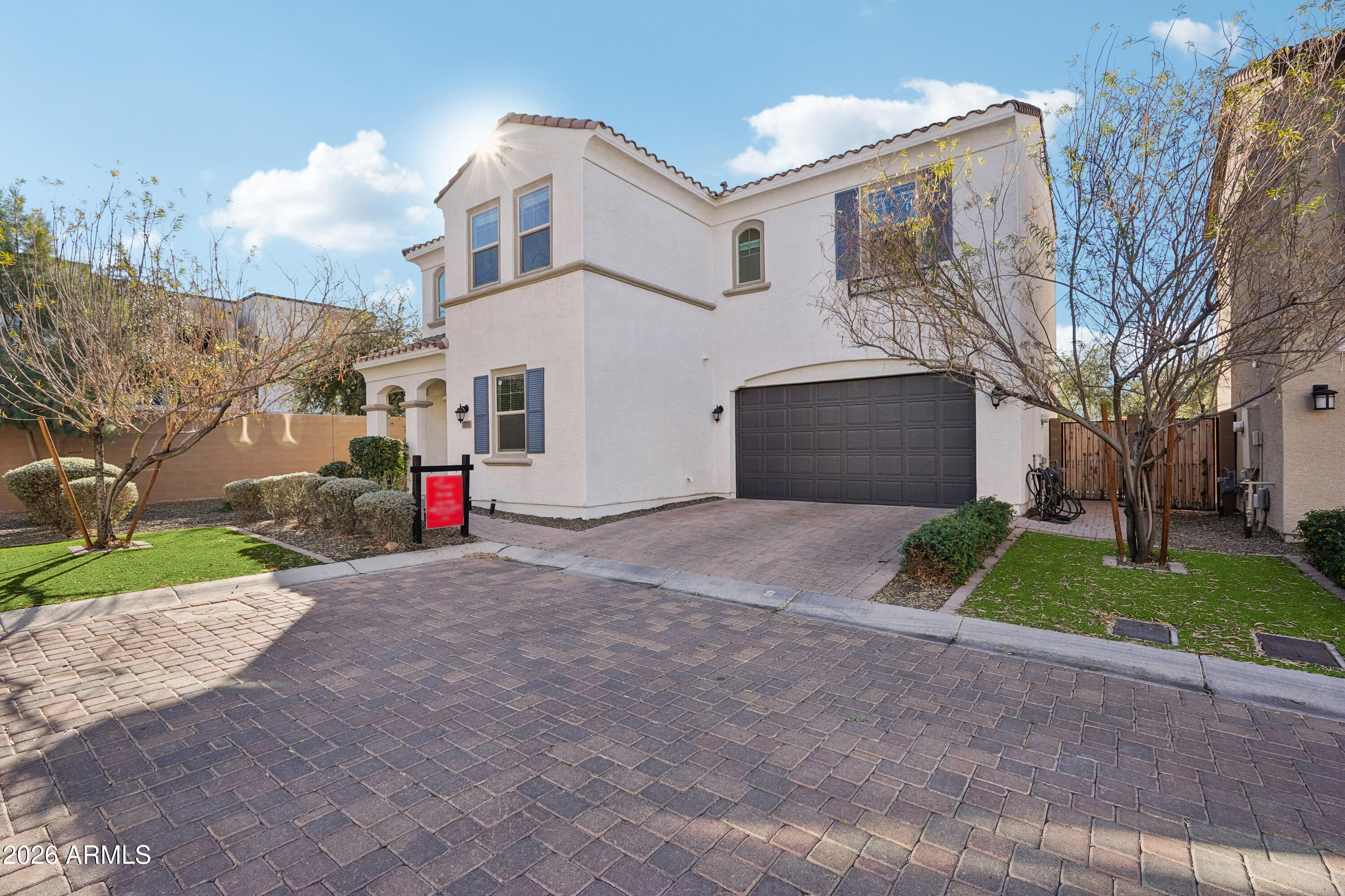 17153 North 10th Street Phoenix, AZ 85022 - Photo 3 of 48 a view of white house with a yard and garage