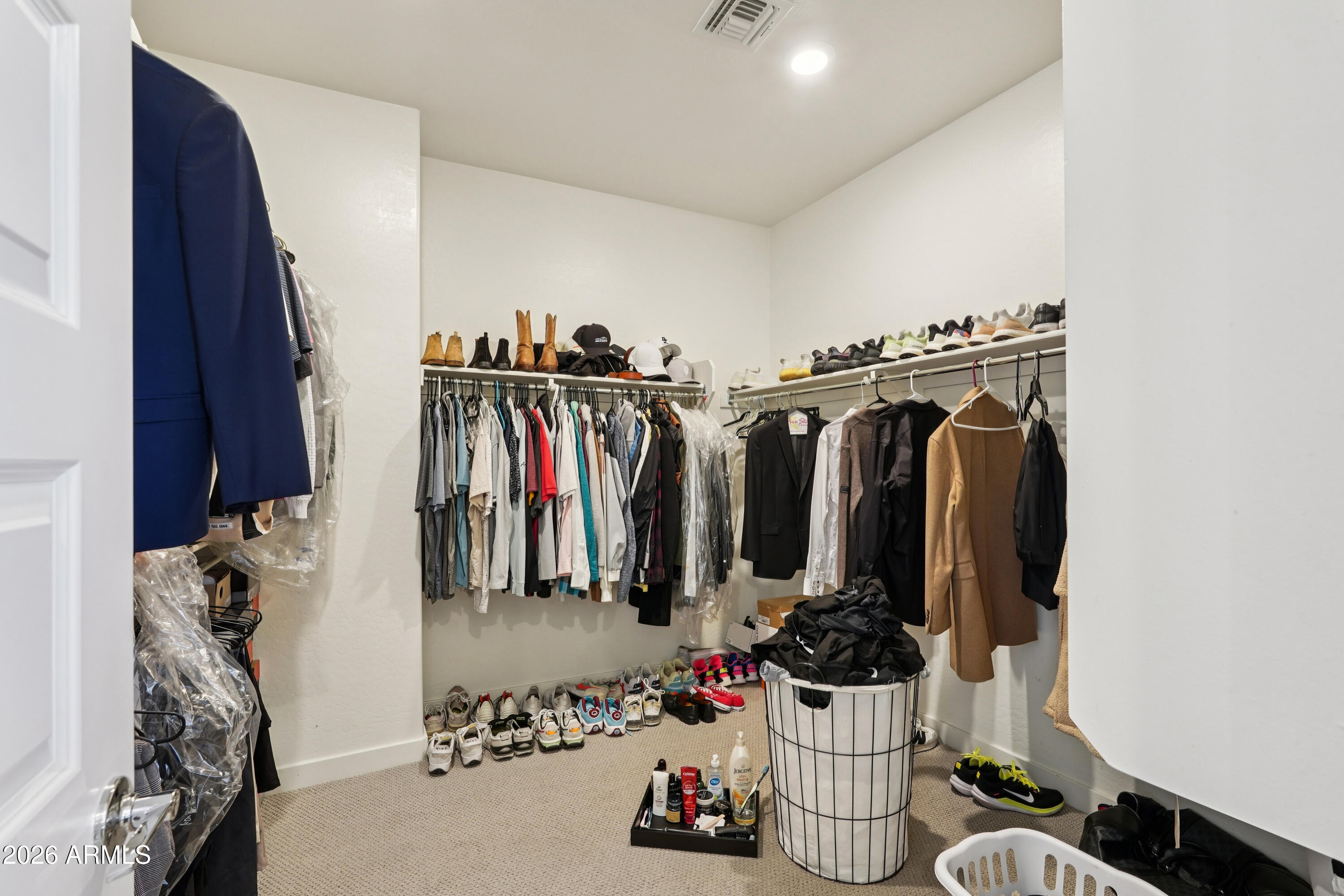 17153 North 10th Street Phoenix, AZ 85022 - Photo 32 of 48 a view of walk in closet with clothes and shoes