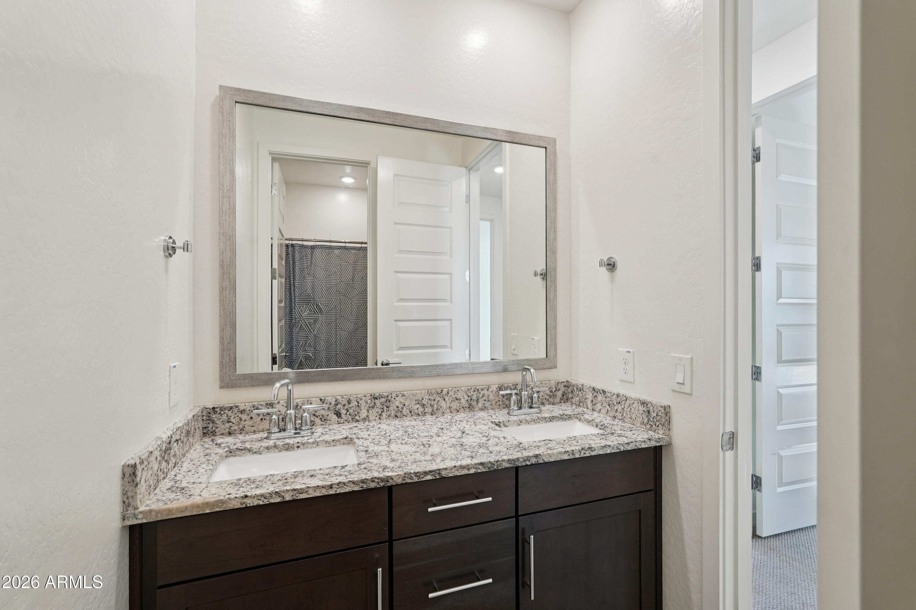 17153 North 10th Street Phoenix, AZ 85022 - Photo 38 of 48 a bathroom with a granite countertop sink and a mirror