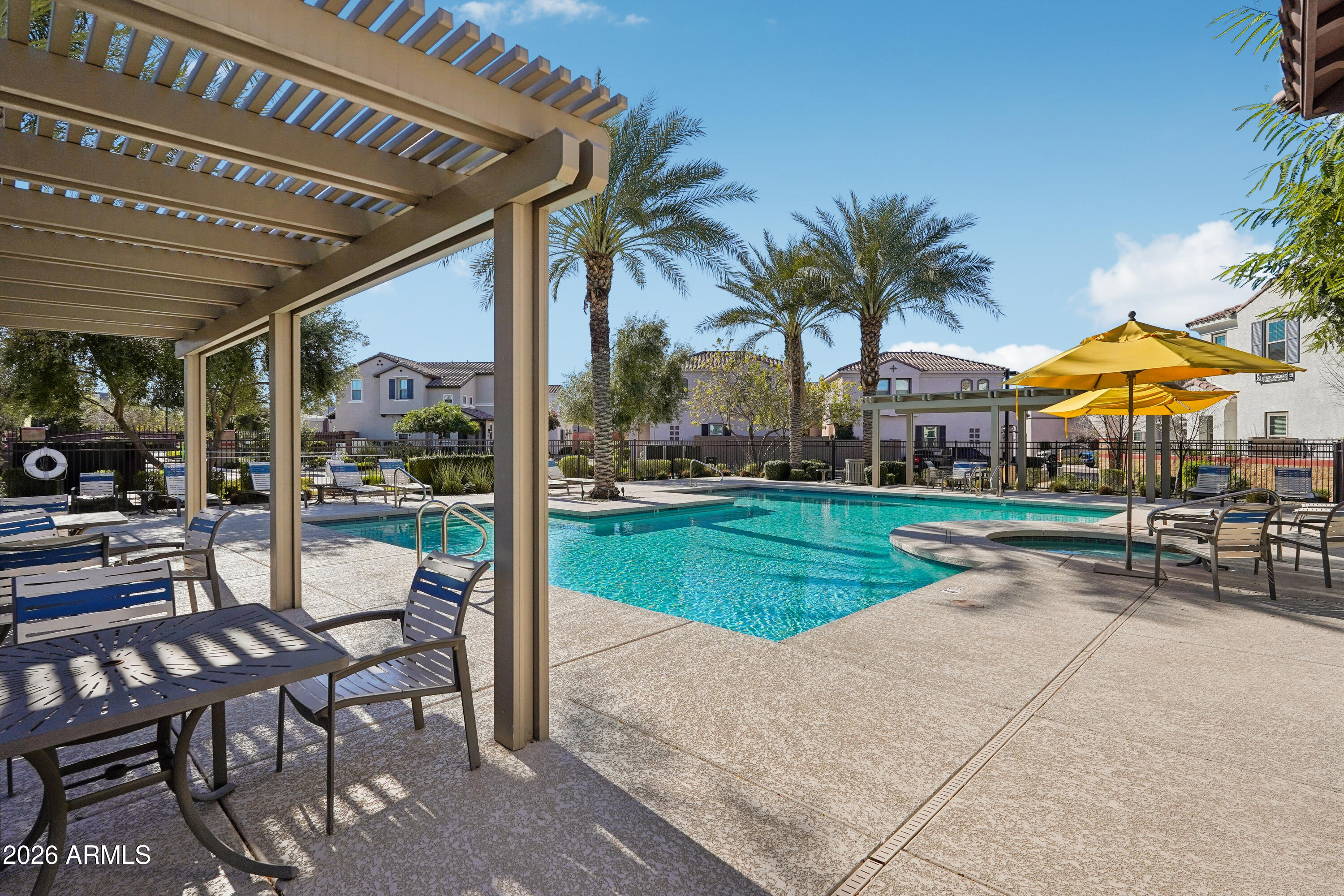 17153 North 10th Street Phoenix, AZ 85022 - Photo 41 of 48 a view of a patio with a table and chairs under an umbrella