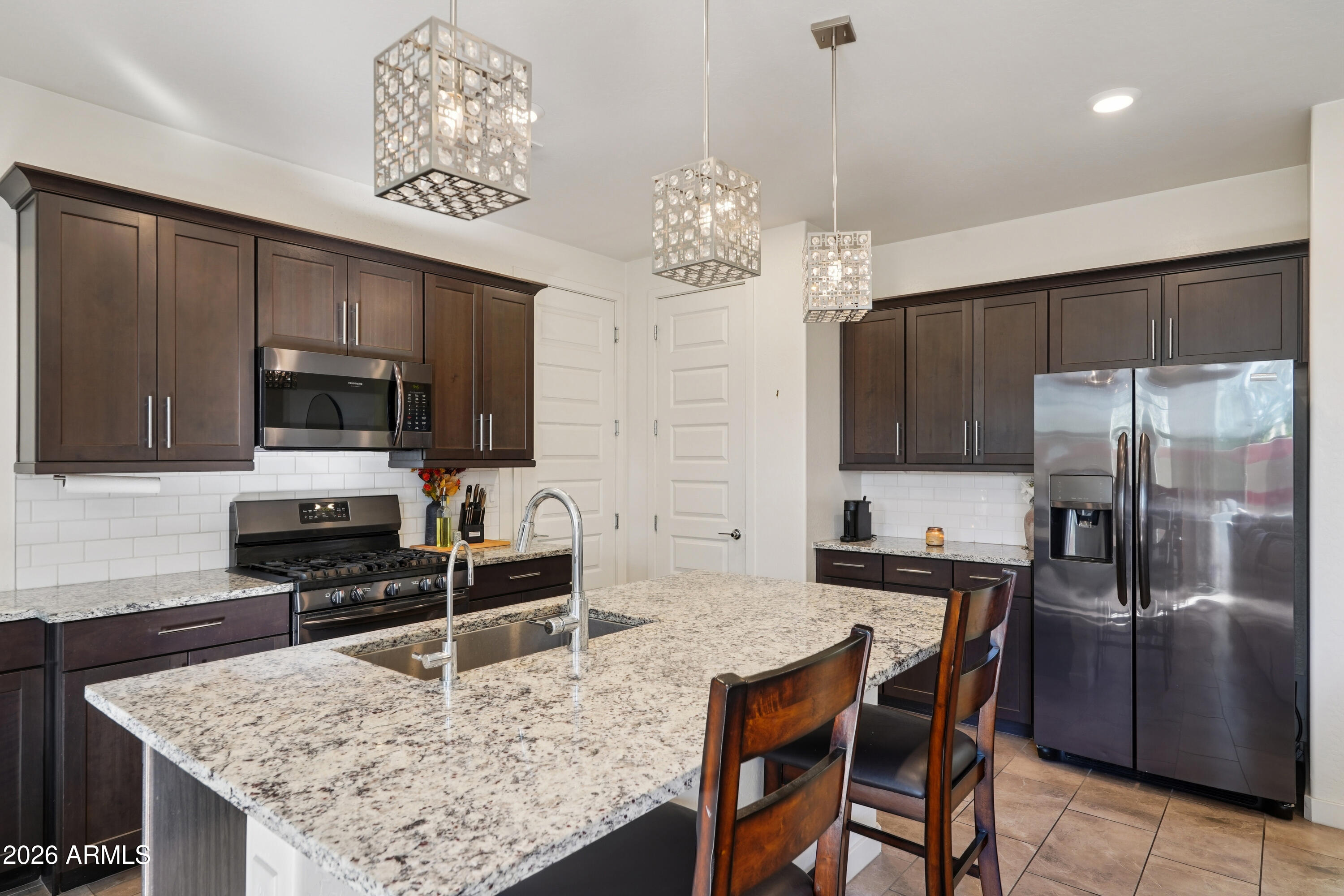 17153 North 10th Street Phoenix, AZ 85022 - Photo 9 of 48 a kitchen with stainless steel appliances granite countertop a stove refrigerator and microwave