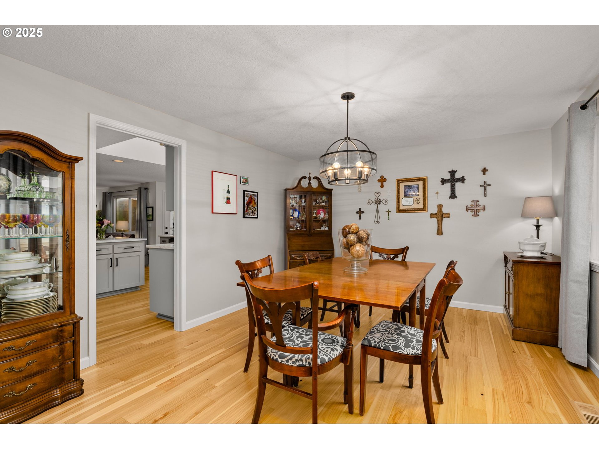 12808 Southwest Falcon Rise Drive Portland, OR 97223 - Photo 11 of 46 a view of a dining room with furniture and wooden floor