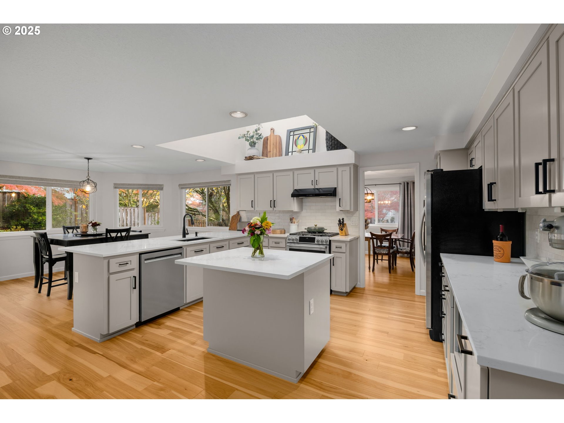 12808 Southwest Falcon Rise Drive Portland, OR 97223 - Photo 16 of 46 a kitchen with stainless steel appliances granite countertop a sink dishwasher stove top oven and cabinets