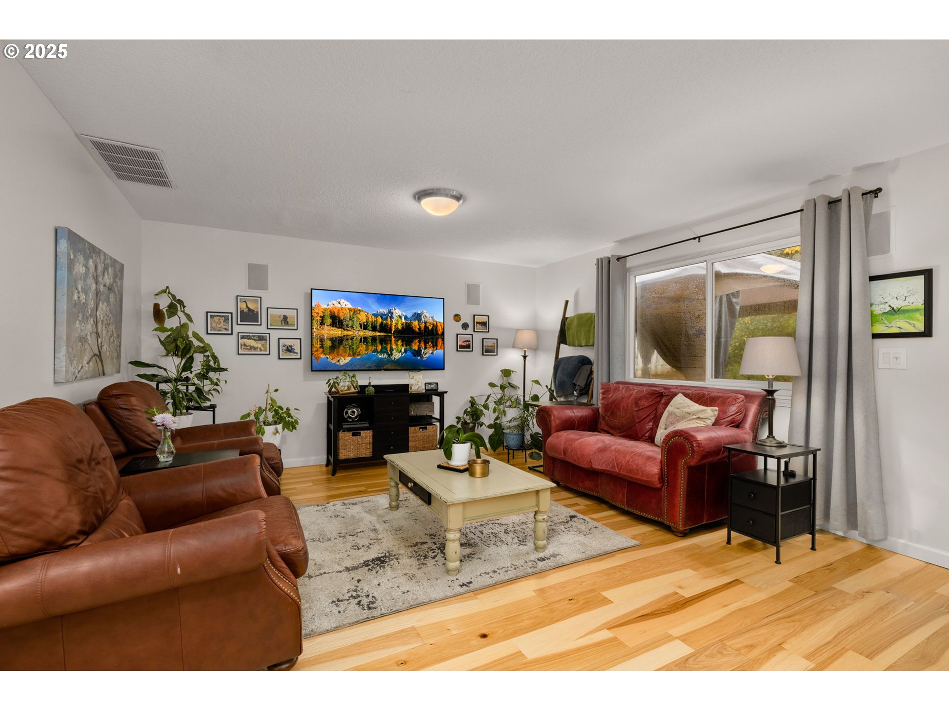12808 Southwest Falcon Rise Drive Portland, OR 97223 - Photo 21 of 46 a living room with furniture and a flat screen tv