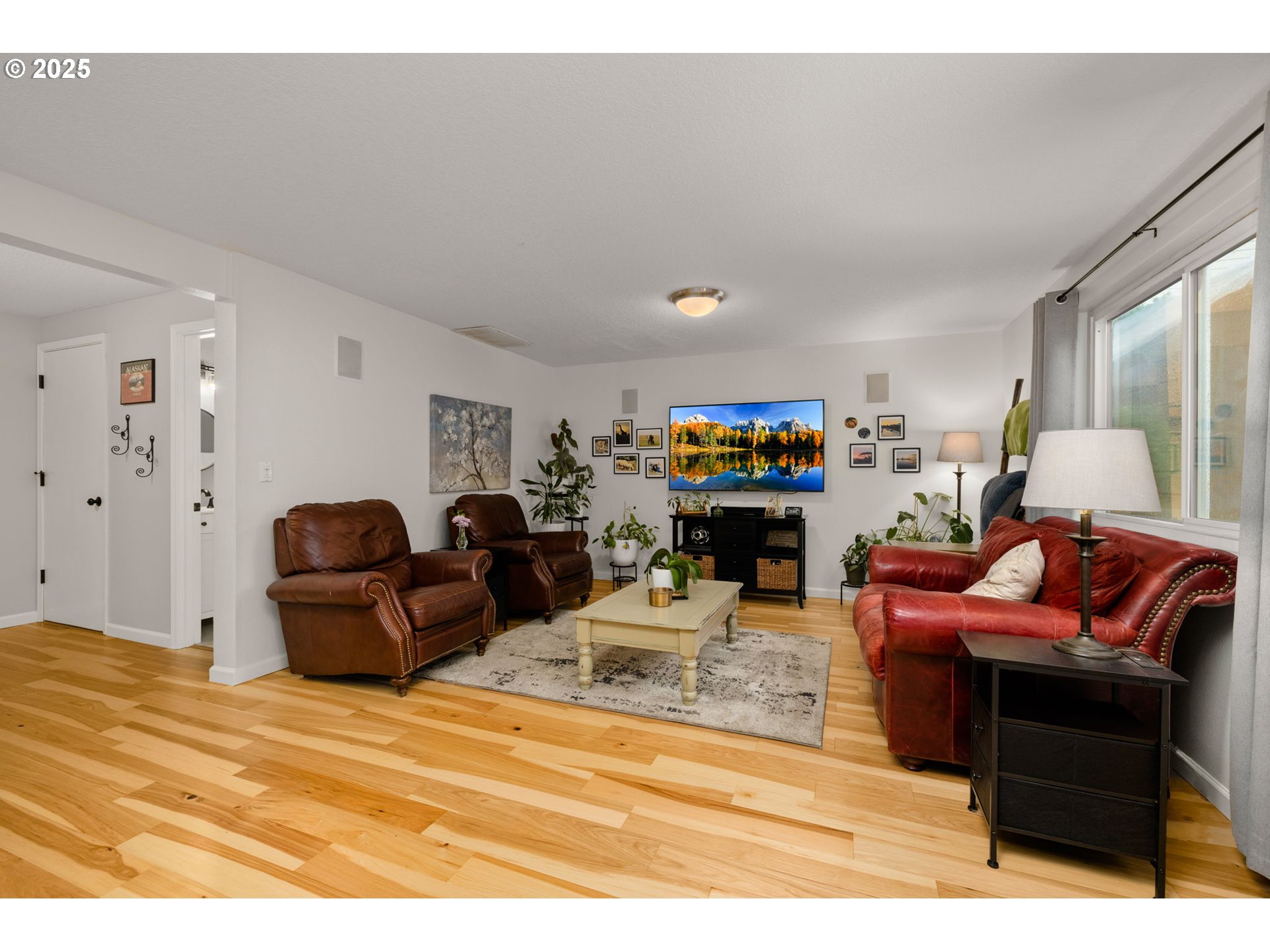 12808 Southwest Falcon Rise Drive Portland, OR 97223 - Photo 22 of 46 a living room with furniture and a flat screen tv