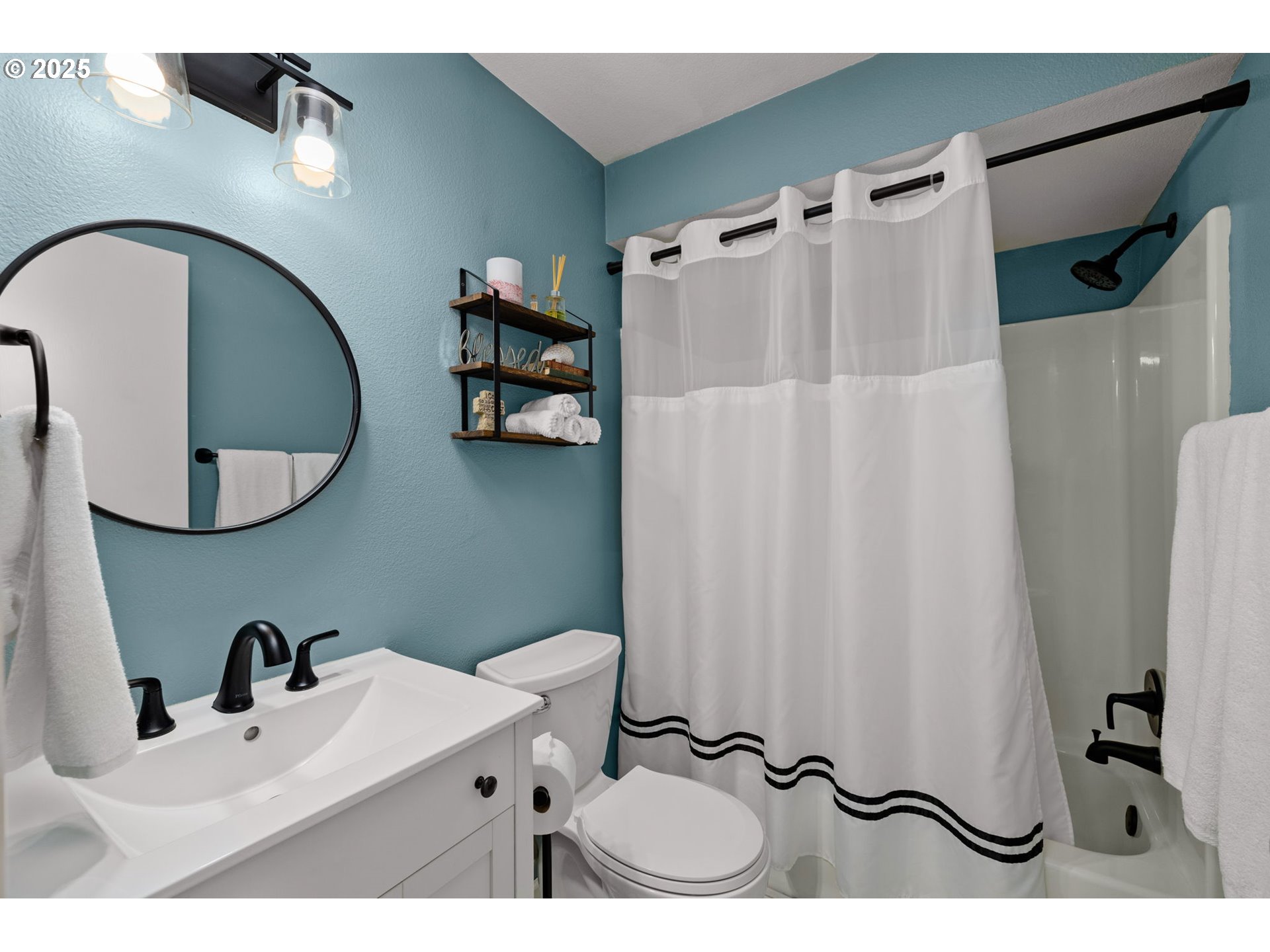 12808 Southwest Falcon Rise Drive Portland, OR 97223 - Photo 24 of 46 a bathroom with a sink and mirror