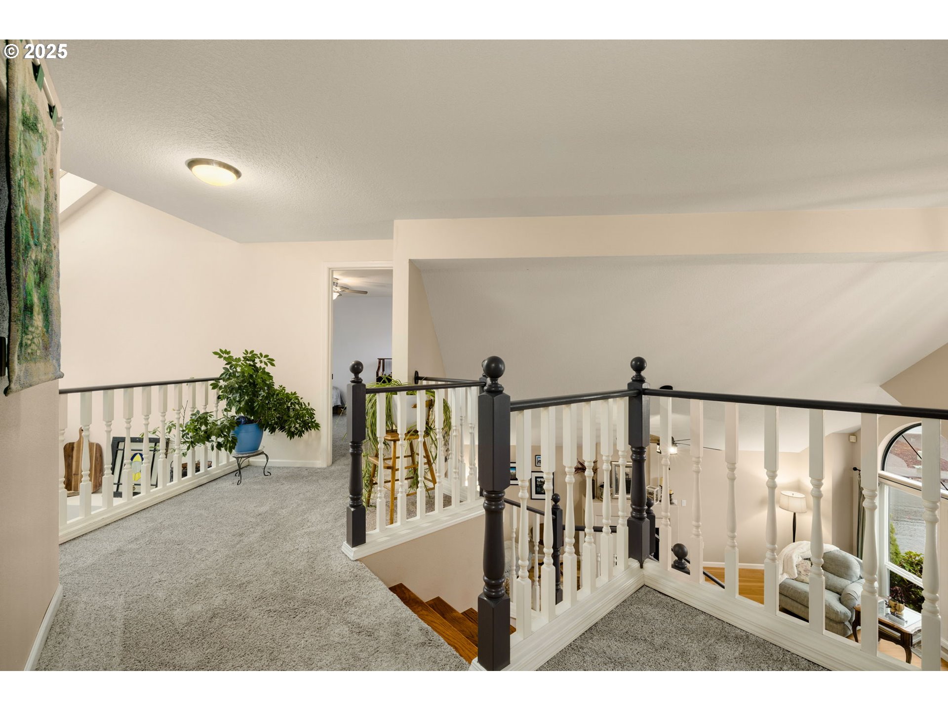 12808 Southwest Falcon Rise Drive Portland, OR 97223 - Photo 26 of 46 a view of a hallway with wooden floor and windows