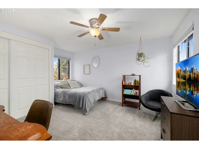 a bedroom with a bed furniture and window