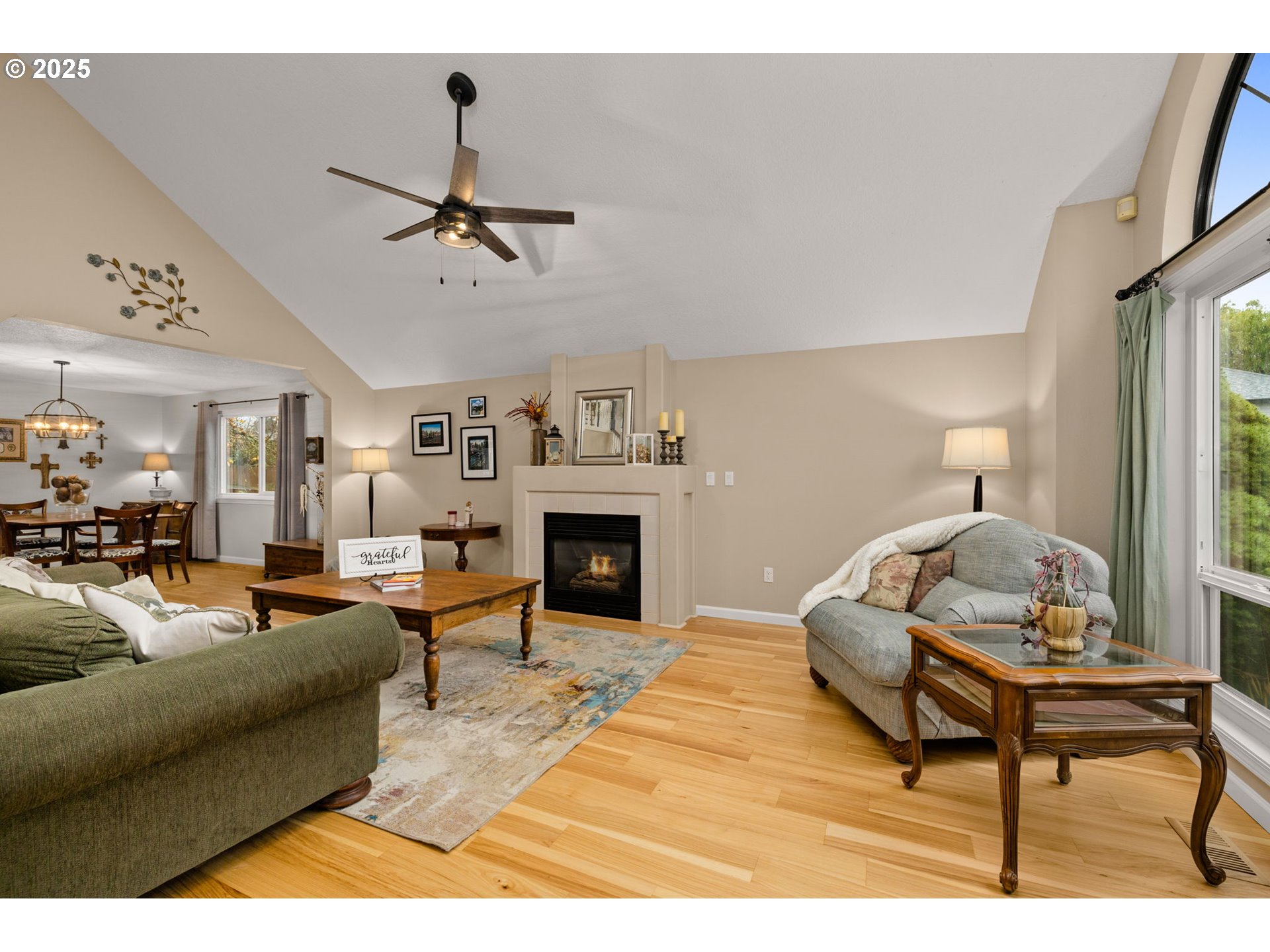 12808 Southwest Falcon Rise Drive Portland, OR 97223 - Photo 5 of 46 a living room with furniture and a fireplace