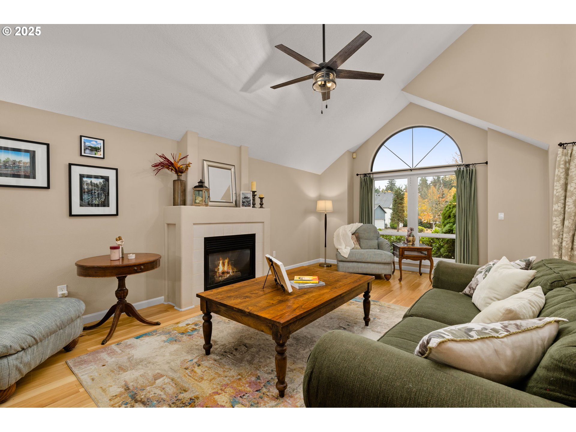 12808 Southwest Falcon Rise Drive Portland, OR 97223 - Photo 9 of 46 a living room with furniture a chandelier and a fireplace