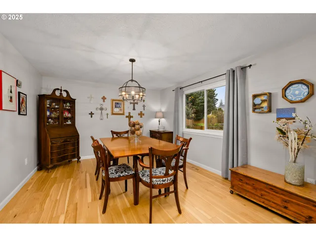 a view of a dining room with furniture and window