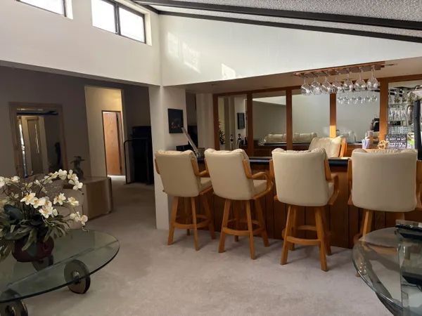 a view of a dining room with furniture window and outside view
