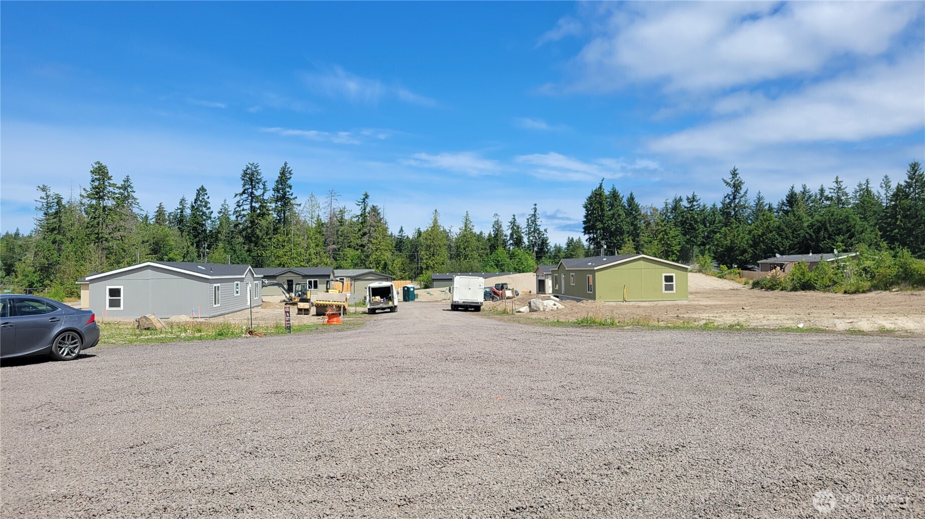 82 Butterfly Lane Sequim, WA 98382 - Photo 4 of 4 a view of yard with swimming pool and trees in the background