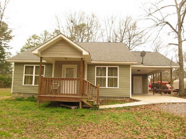 16 Green Acre Road Northeast Rome, GA 30165 - Photo 1 of 1 a front view of a house with a yard
