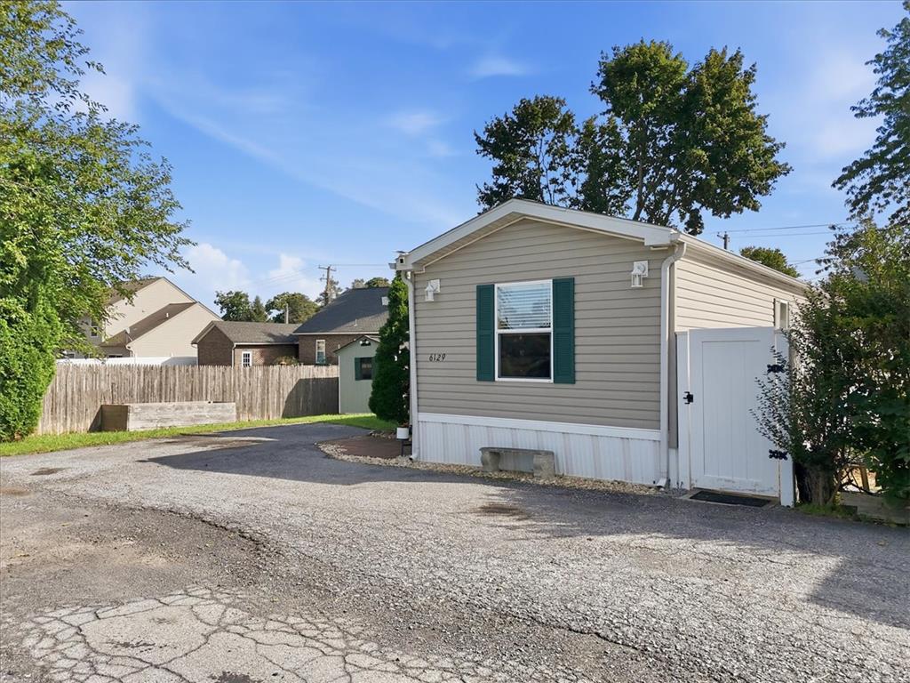 6129 Memorial Road Allentown, PA 18104 - Photo 5 of 46 An inviting exterior welcomes you with structured vinyl siding and a private side gate.