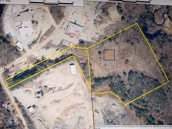 an aerial view of a house with a backyard