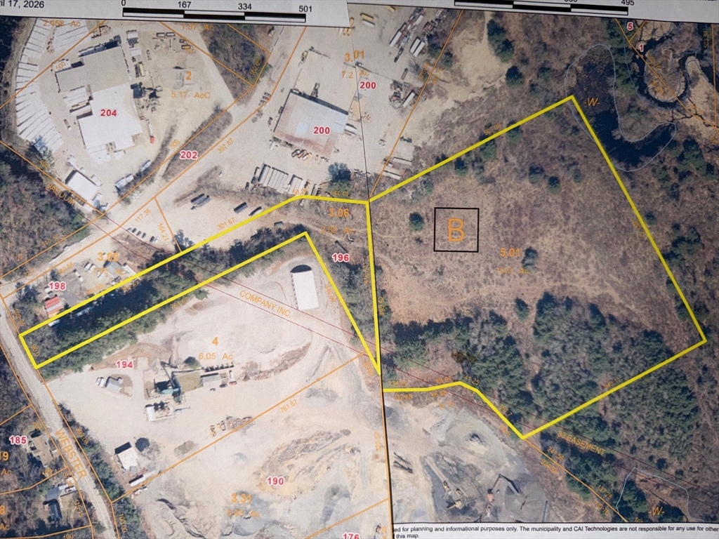 an aerial view of a house with a backyard