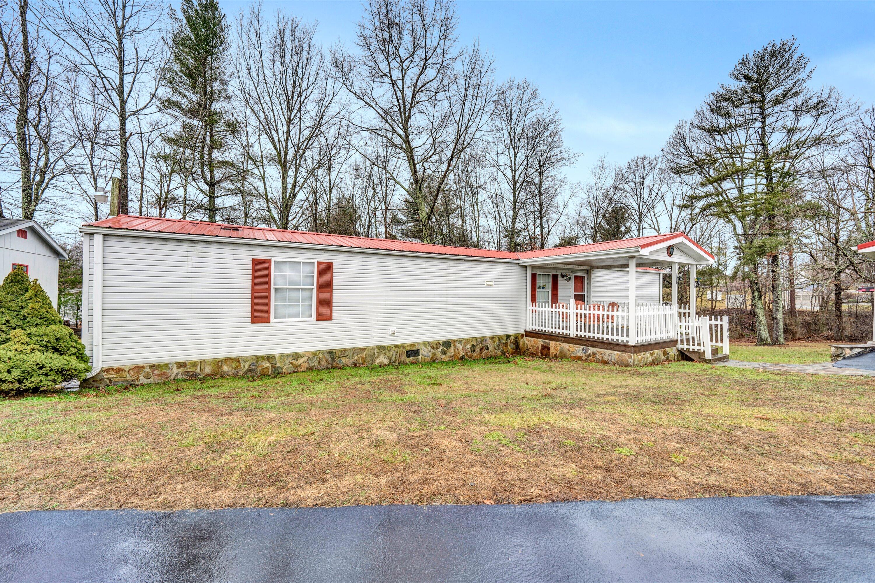 706 Telegraph Road Henry, VA 24102 - Photo 1 of 17 a backyard of a house with table and chairs
