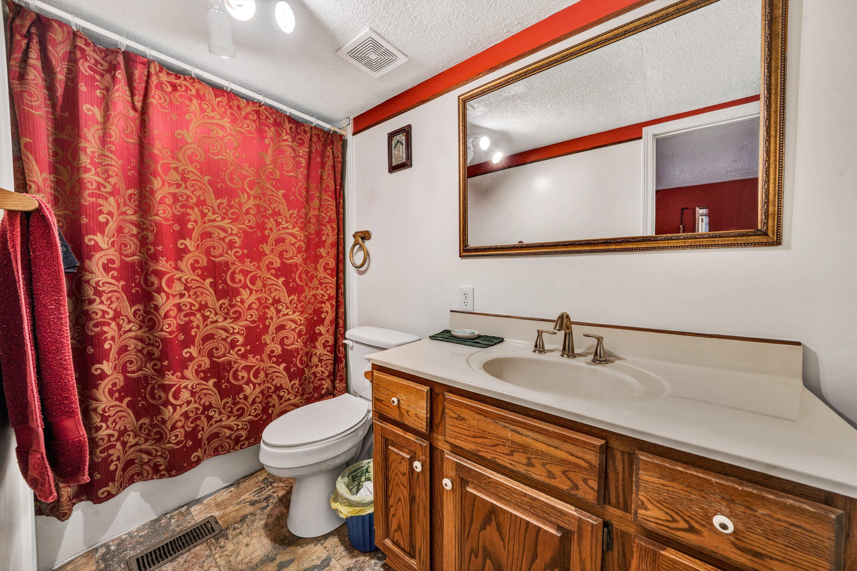 706 Telegraph Road Henry, VA 24102 - Photo 12 of 17 a bathroom with a sink toilet and shower