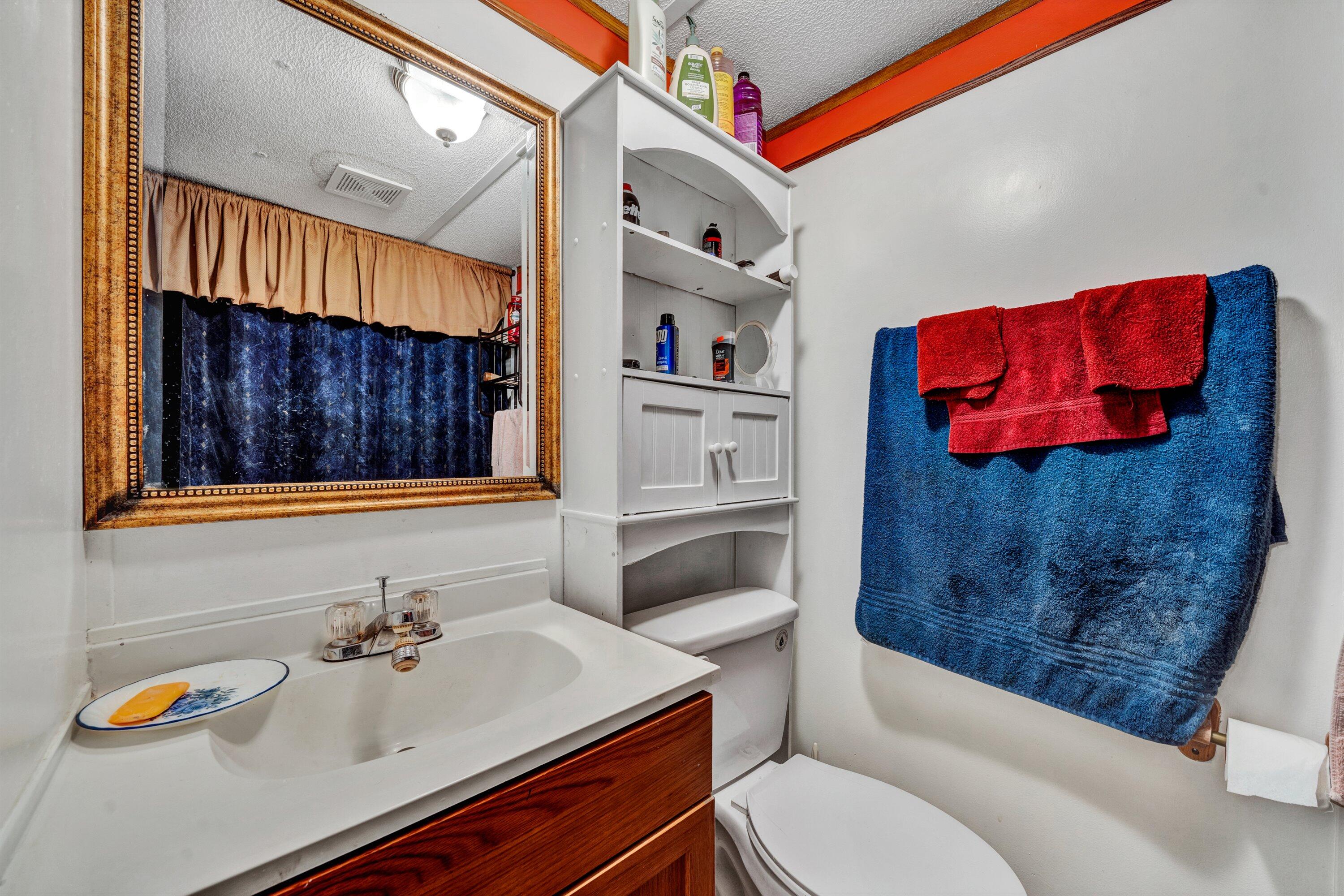 706 Telegraph Road Henry, VA 24102 - Photo 15 of 17 a bathroom with a sink toilet and a bathtub