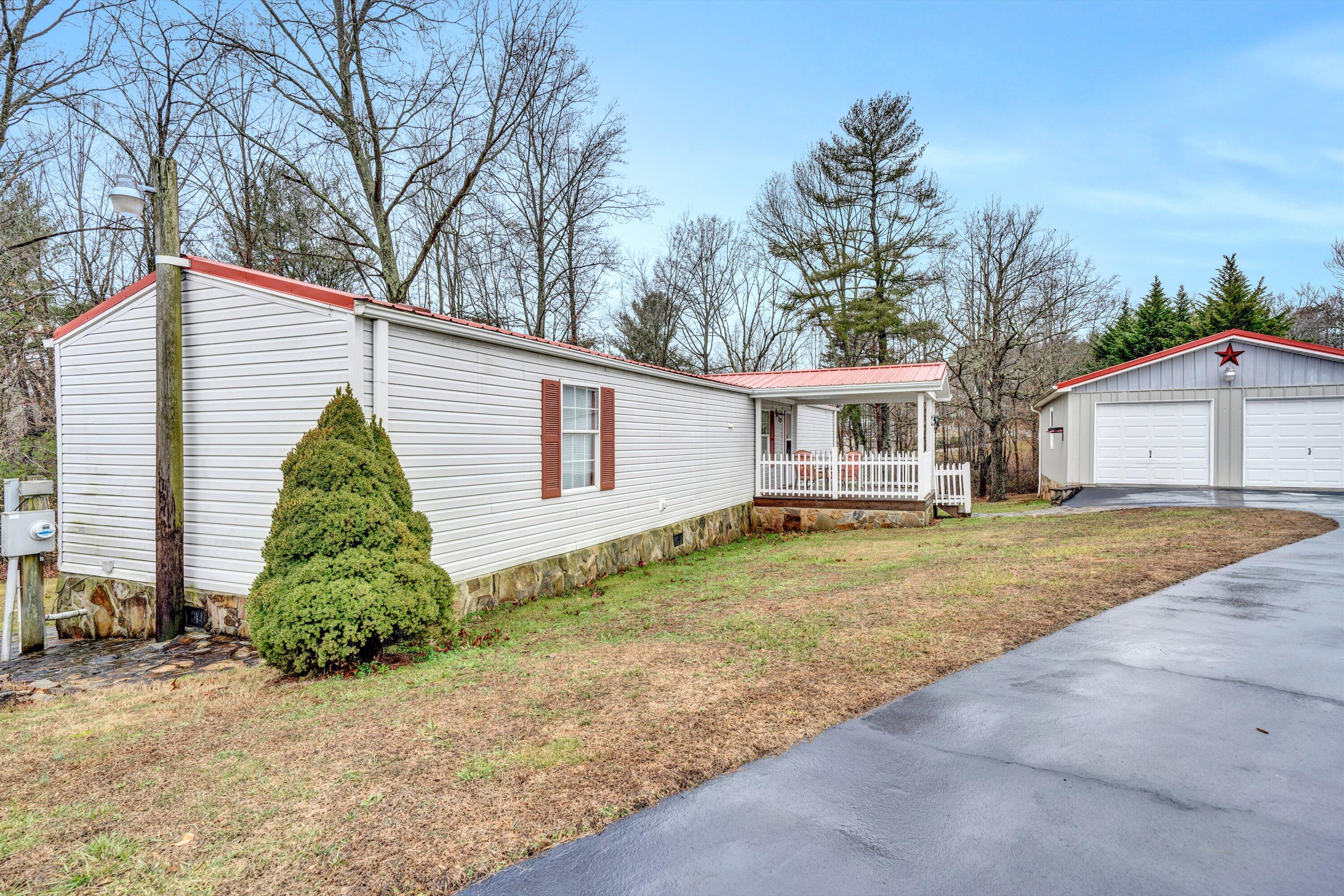 706 Telegraph Road Henry, VA 24102 - Photo 2 of 17 a view of a house with a backyard