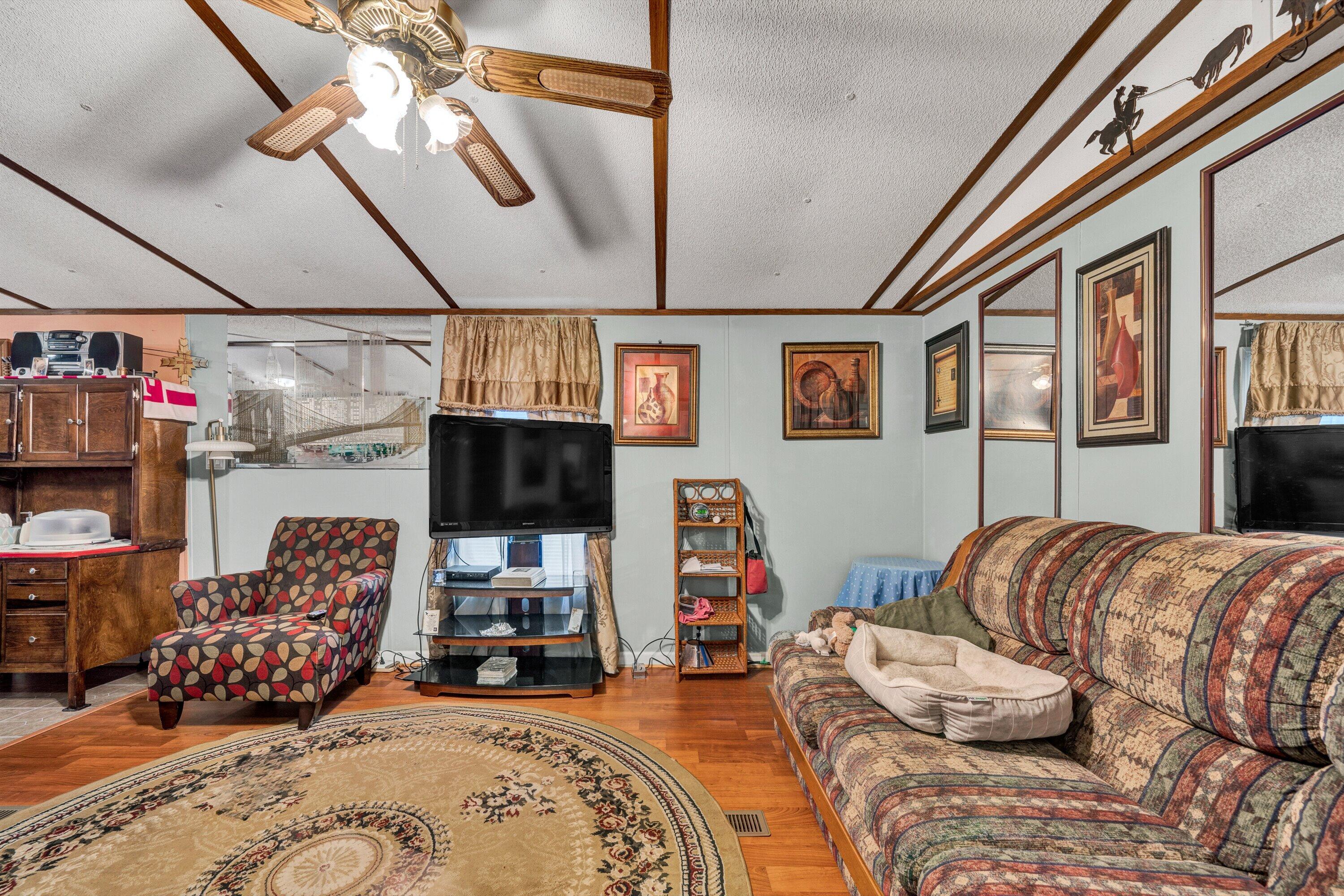 706 Telegraph Road Henry, VA 24102 - Photo 8 of 17 a bedroom with furniture and a flat screen tv
