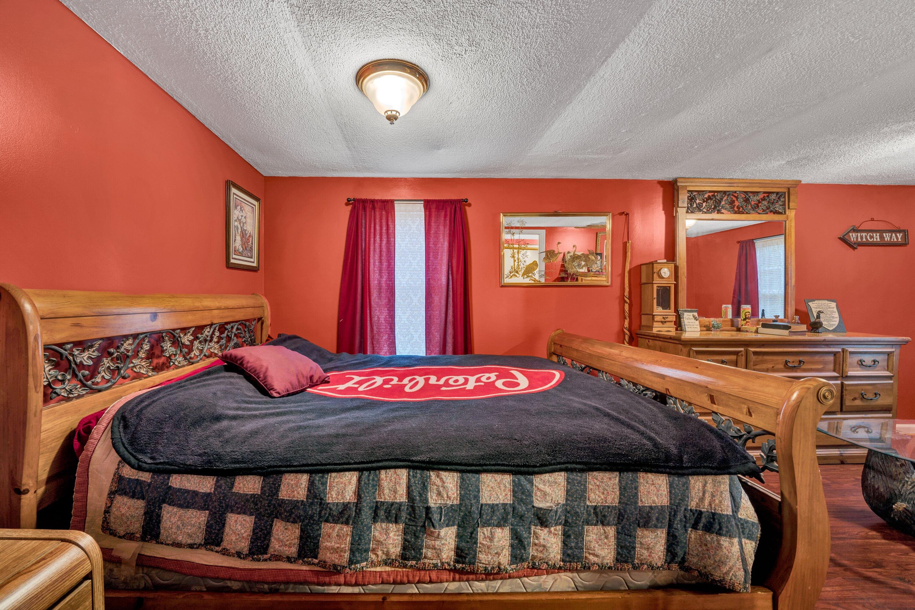 706 Telegraph Road Henry, VA 24102 - Photo 10 of 17 a bedroom with a bed and glass windows