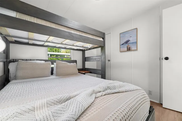 a large white bed in a white room