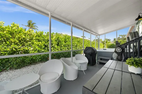 a view of a patio filled with furniture