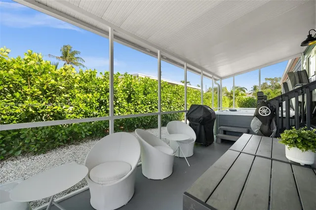 a view of a patio filled with furniture