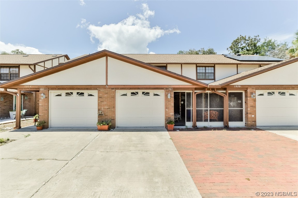 a front view of a house with a outdoor space