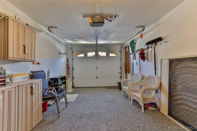 a view of a livingroom with furniture and a window