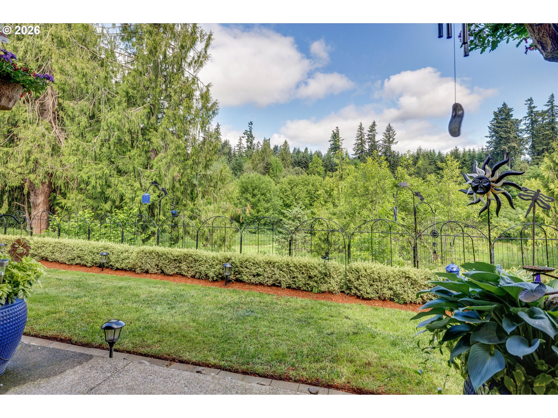 3769 10th Street Hubbard, OR 97032 - Photo 39 of 47 a view of a garden with a fountain