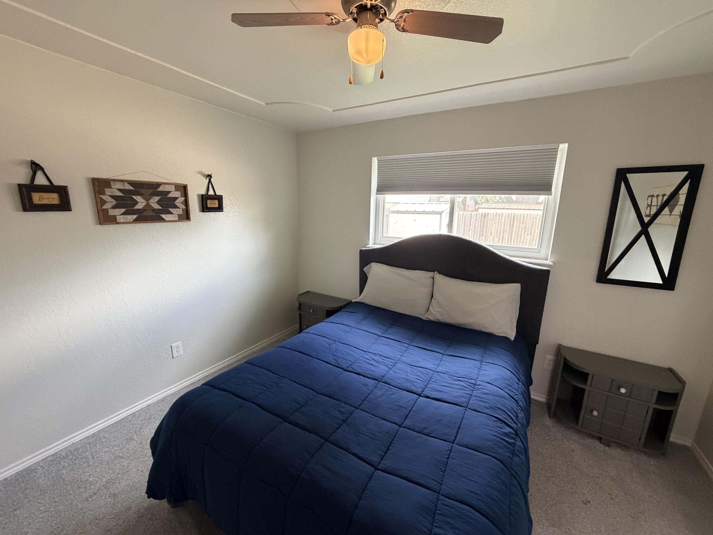 3236 94th Street Lubbock, TX 79423 - Photo 22 of 31 a bedroom with a bed and window
