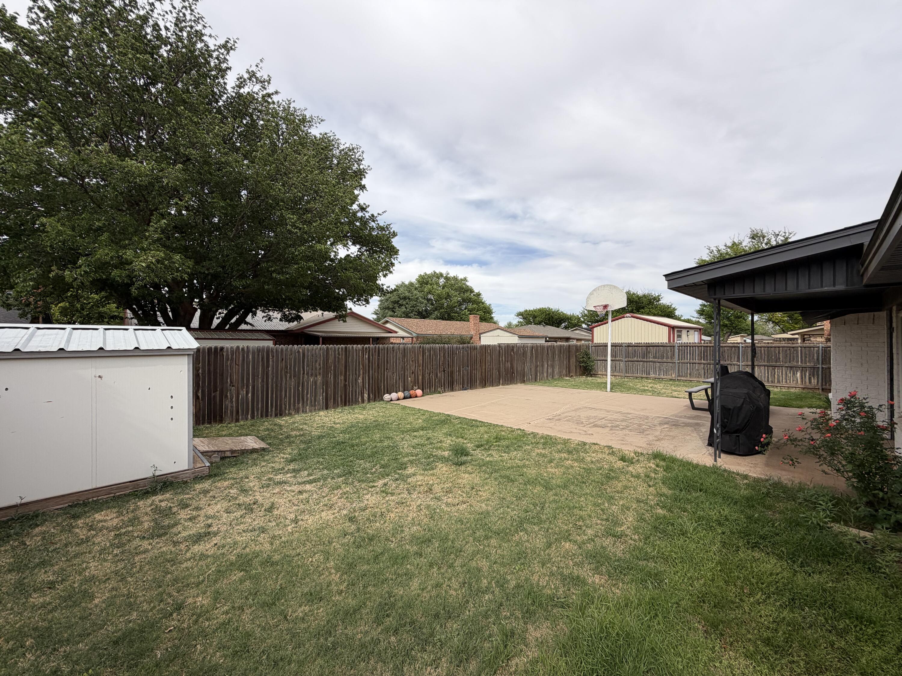 3236 94th Street Lubbock, TX 79423 - Photo 28 of 31 a view of a backyard with sitting area