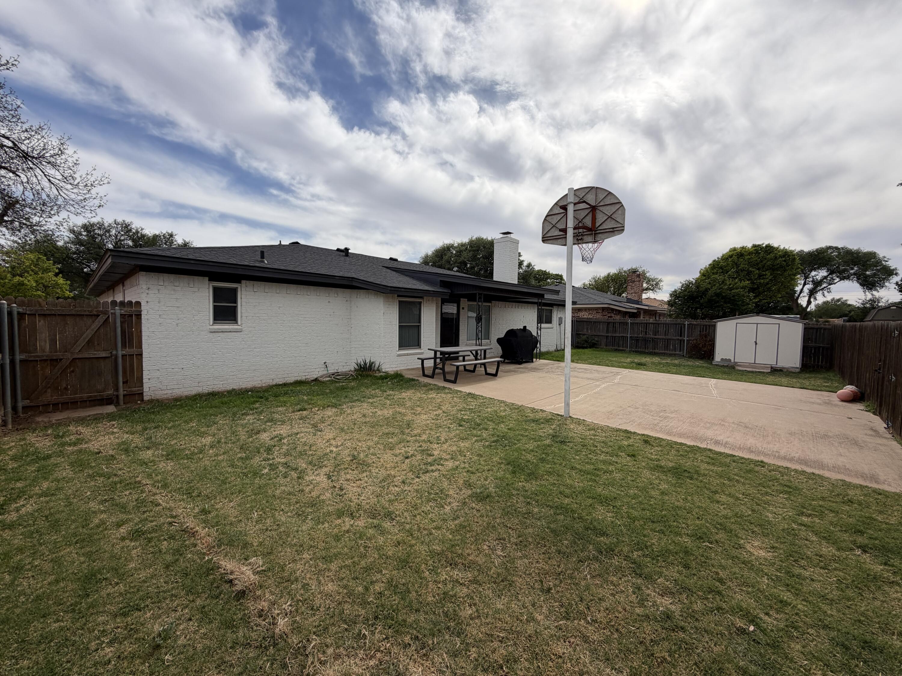 3236 94th Street Lubbock, TX 79423 - Photo 31 of 31 a view of a house with a backyard