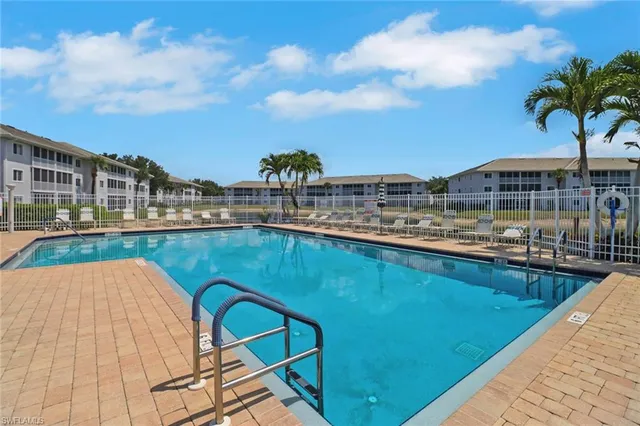 a view of a swimming pool with a terrace