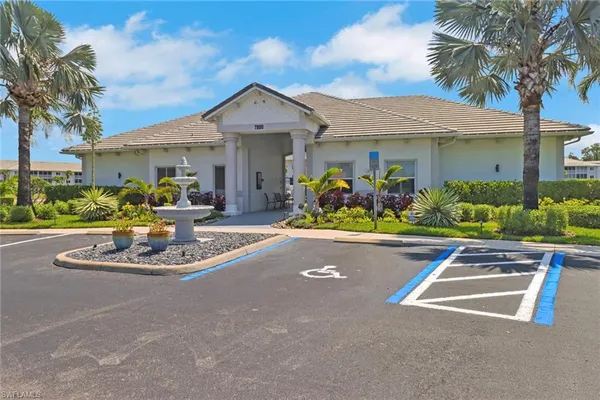 a view of a swimming pool with outdoor seating