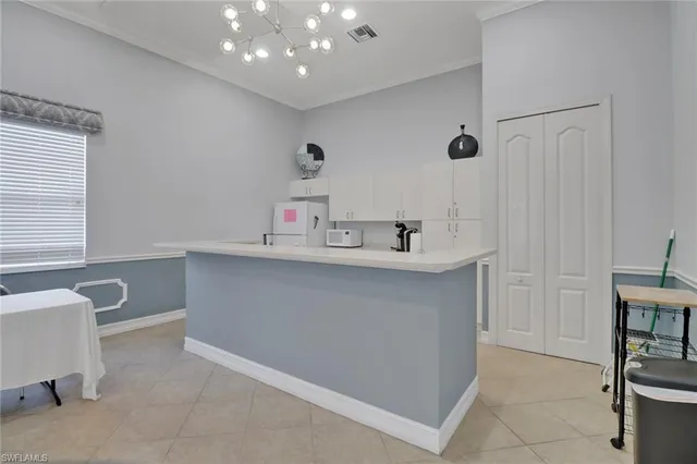 a utility room with sink dryer and washer