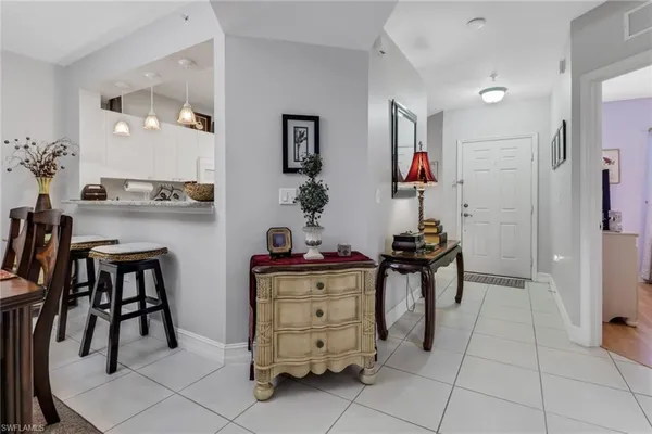 a view of kitchen with furniture and wooden floor