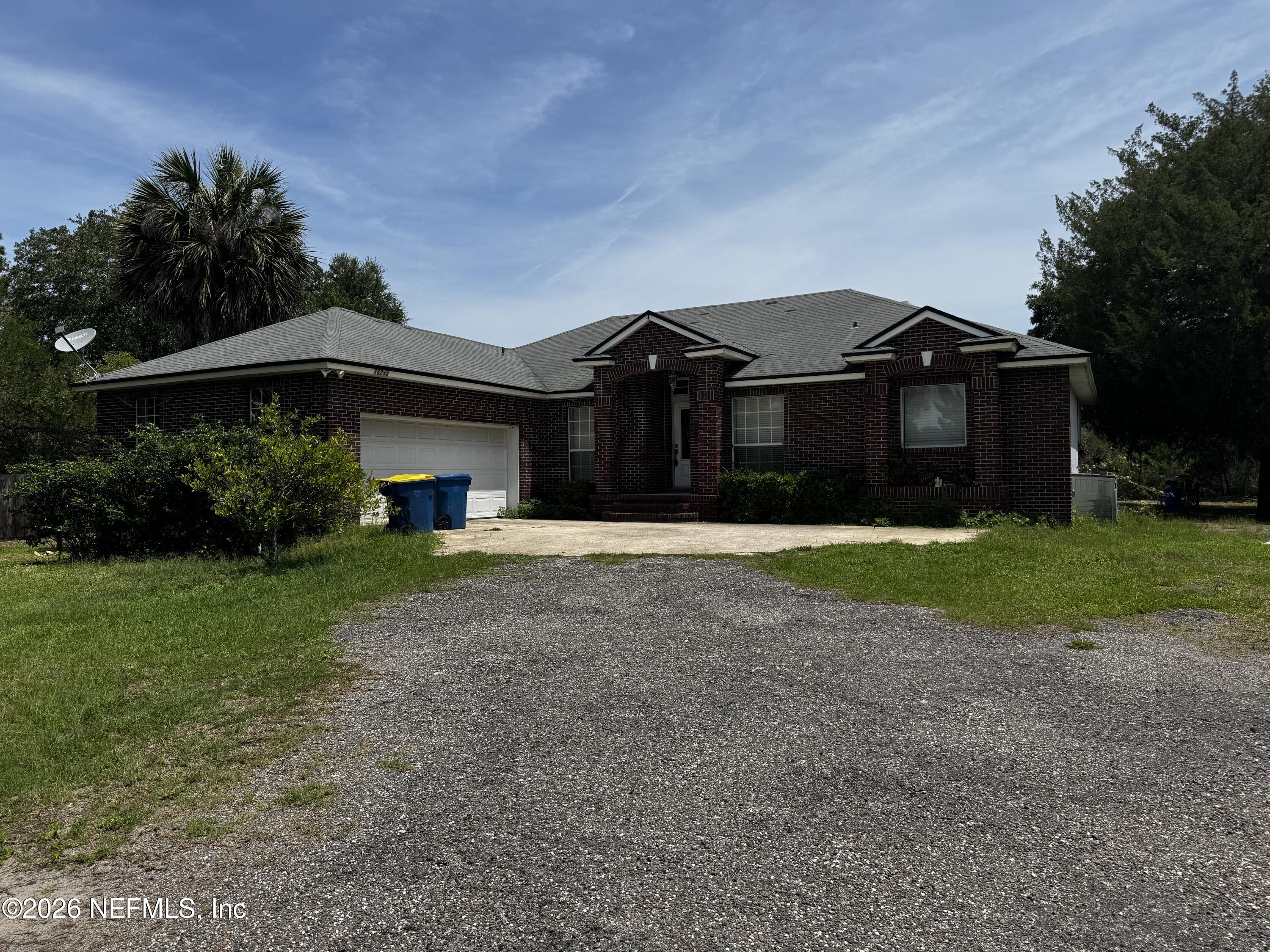 16255 Shellcracker Road Jacksonville, FL 32226 - Photo 3 of 40 a front view of a house with a yard
