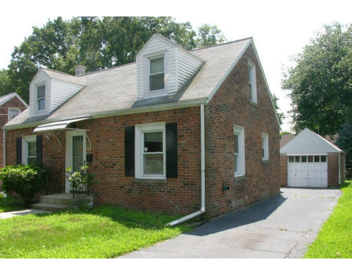 70 Upland Street Springfield, MA 01104 - Photo 1 of 1 a front view of a house with garden