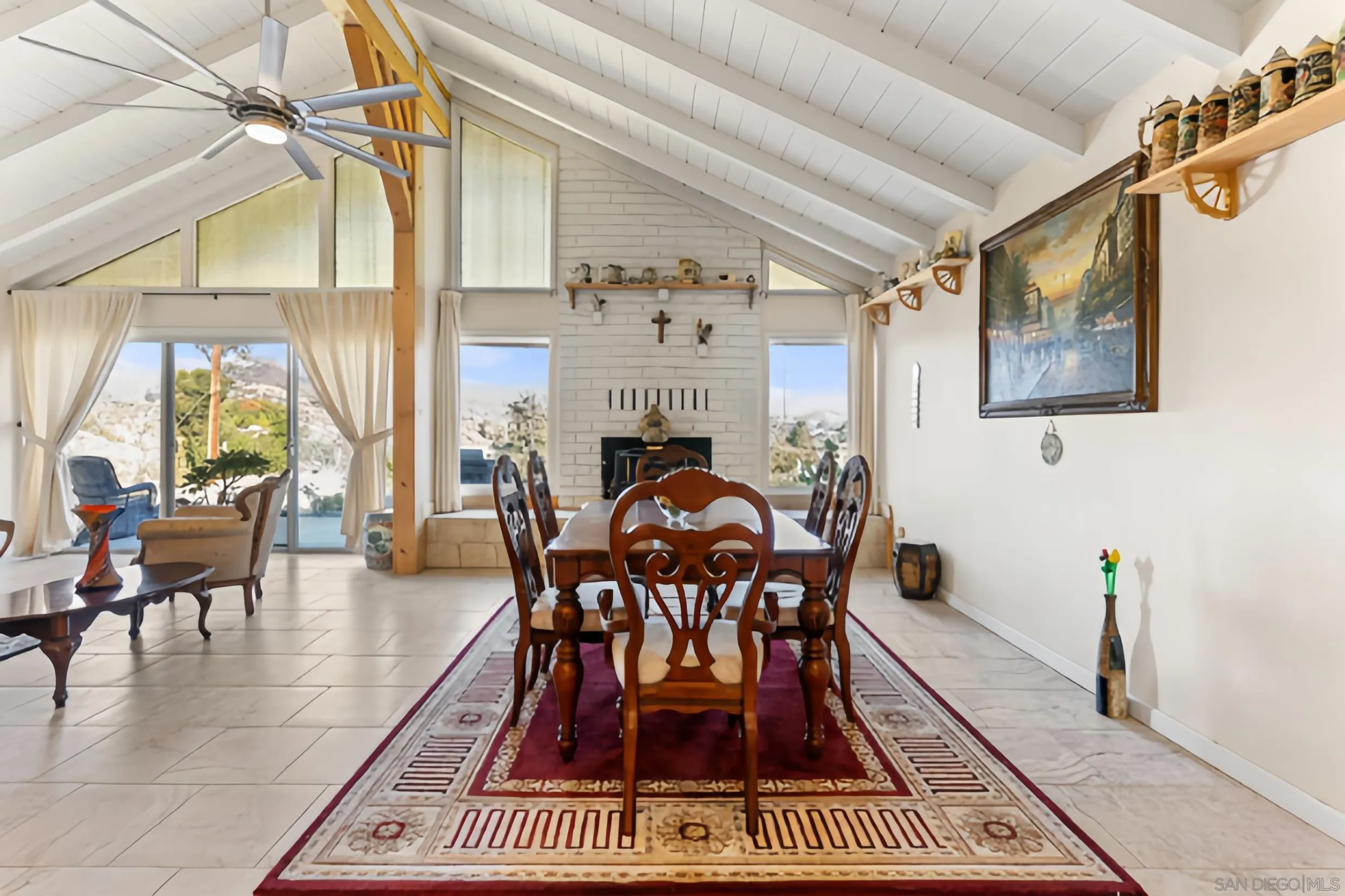 732 Hamilton Lane Fallbrook, CA 92028 - Photo 14 of 54 a dining room with furniture a chandelier and a rug