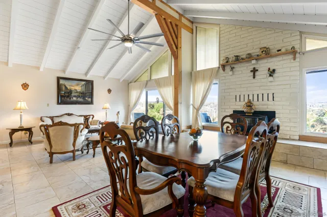 a view of a dining room with furniture window and outside view