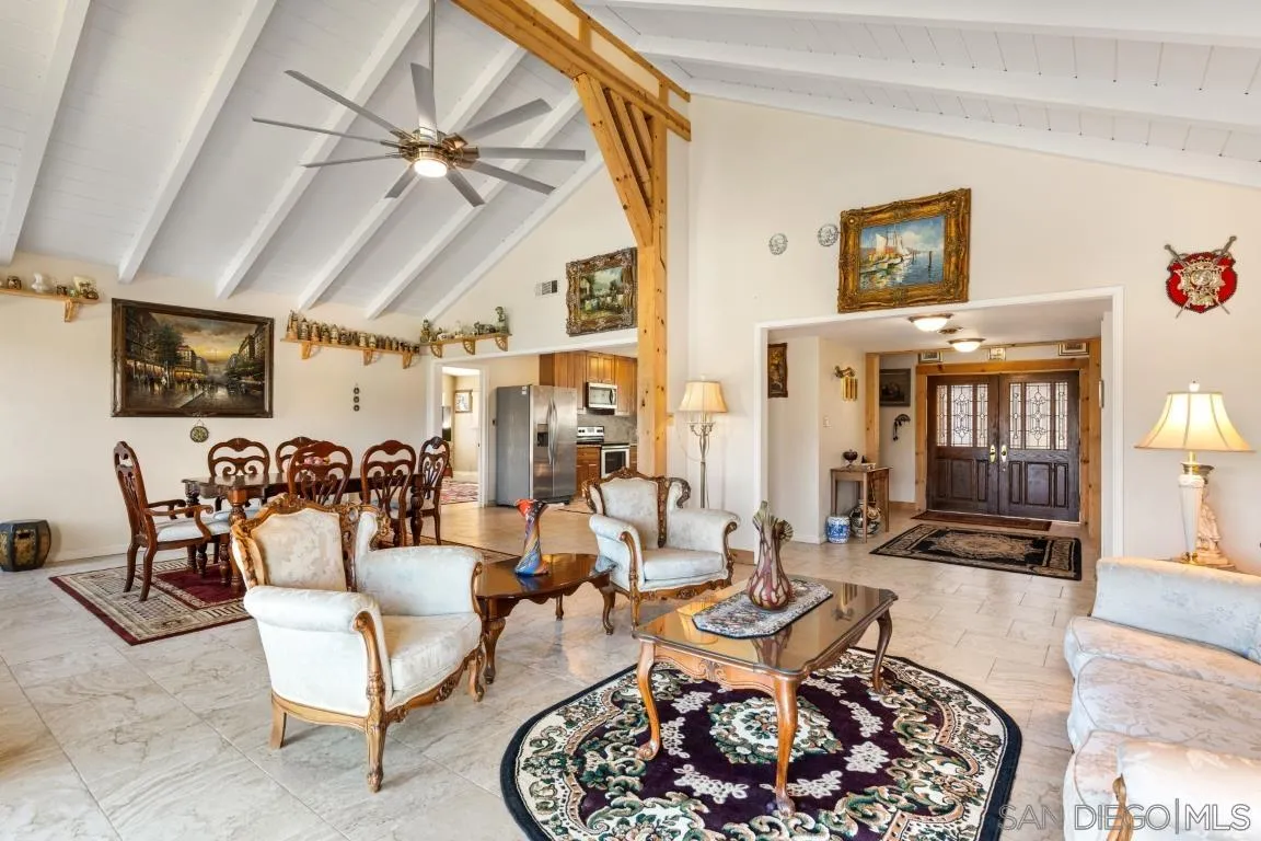 732 Hamilton Lane Fallbrook, CA 92028 - Photo 18 of 54 a living room with furniture and a chandelier