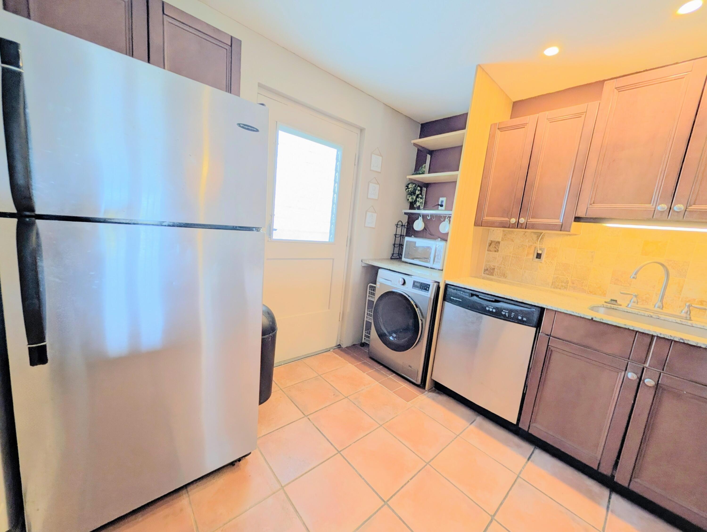 5700 Northwest 2nd Avenue, Unit 509 Boca Raton, FL 33487 - Photo 6 of 20 a utility room with dryer and washer