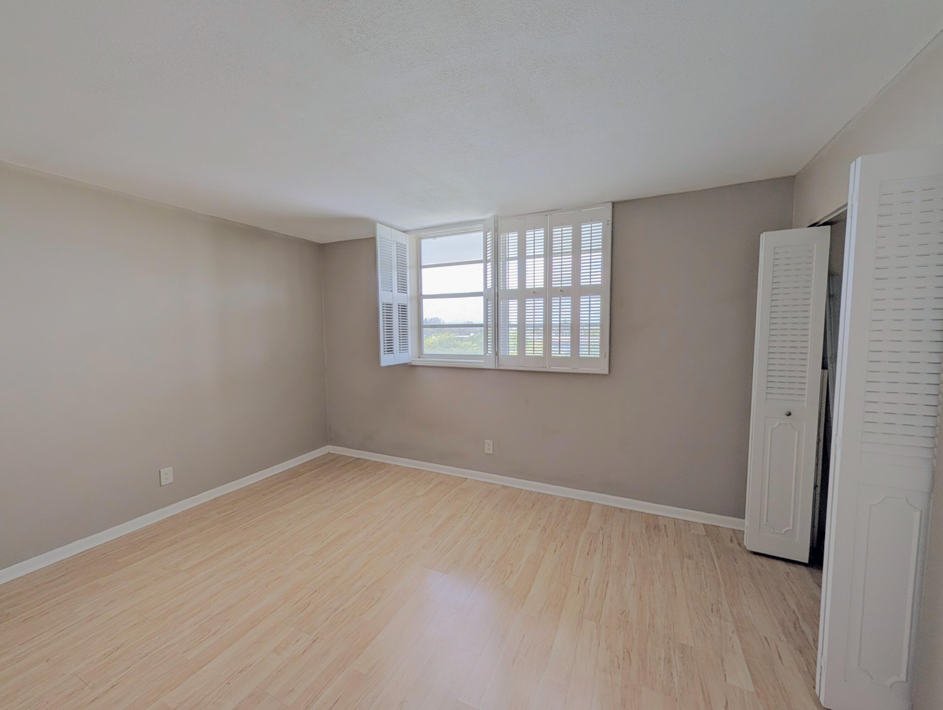 5700 Northwest 2nd Avenue, Unit 509 Boca Raton, FL 33487 - Photo 9 of 20 an empty room with windows